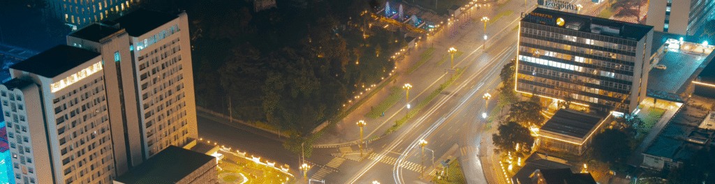 Modern city with lights at night.